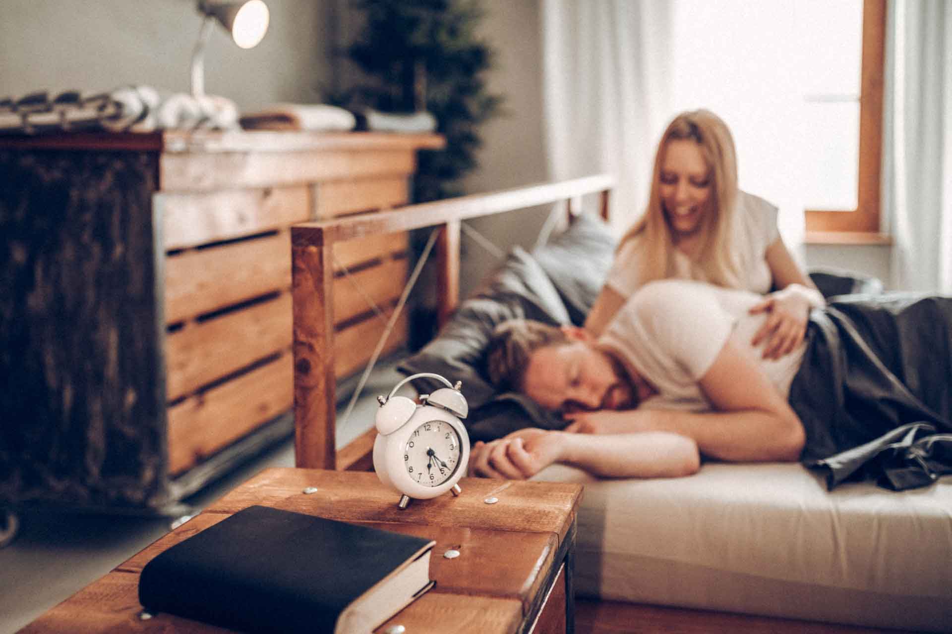 Woman waking up partner