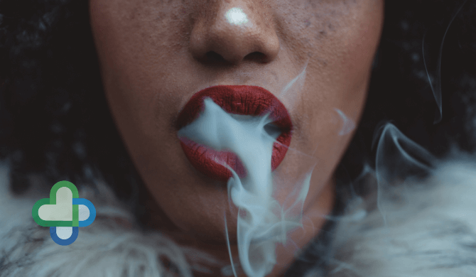 woman smoking with smoke coming out of her mouth - buy stop smoking treatments
