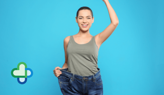 woman on mounjaro who has lost weight holding her arm up