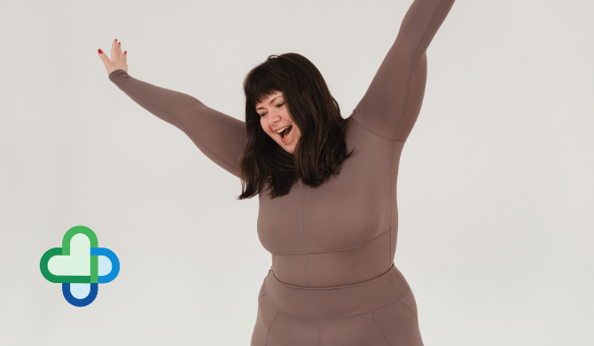 woman on Mounjaro in brown gym set with arms in the air - buy mounjaro online in the UK